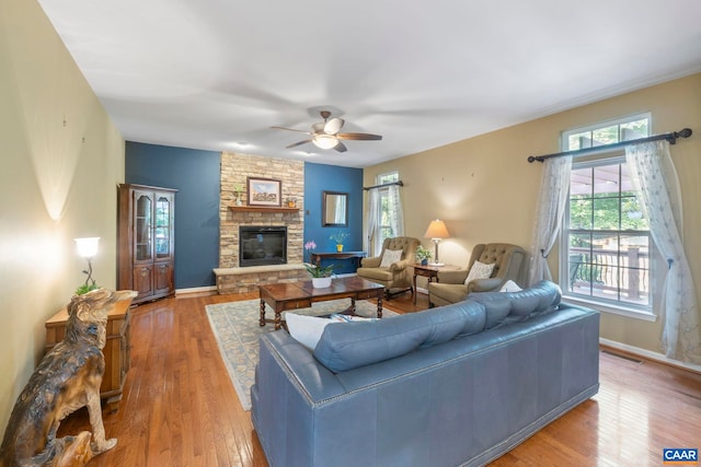 797 Willow Ridge Rd, Troy, VA 22974 - living room with a ceiling fan, wood finished floors, and a stone fireplace