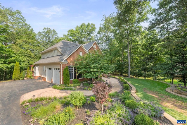 797 Willow Ridge Rd, Troy, VA 22974 - view of front of property with brick siding, asphalt driveway, a garage, and a front yard