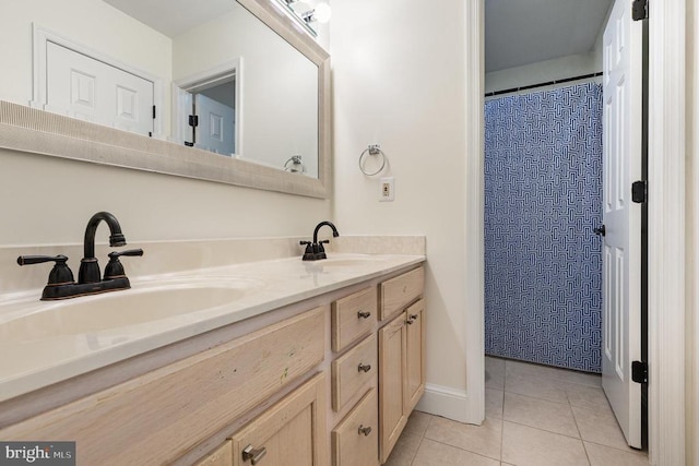  - bathroom with double vanity, tile patterned floors, and a shower with shower curtain