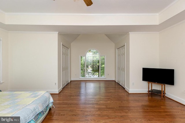  - unfurnished bedroom featuring wood finished floors and ornamental molding