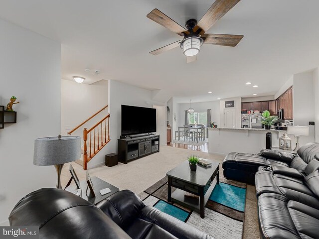 1420 Teagan Dr, Fredericksburg, VA 22408 - living area featuring a ceiling fan, light colored carpet, recessed lighting, and stairway