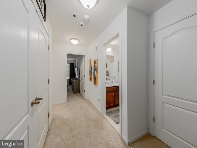 1420 Teagan Dr, Fredericksburg, VA 22408 - corridor with light colored carpet, baseboards, and a sink