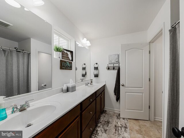 1420 Teagan Dr, Fredericksburg, VA 22408 - bathroom with double vanity and baseboards