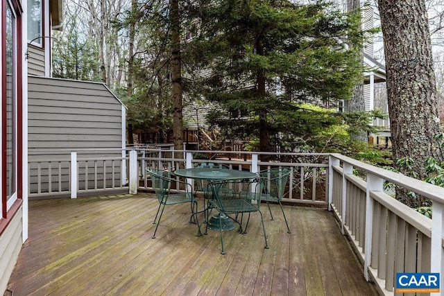 deck with outdoor dining space