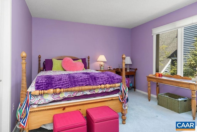 carpeted bedroom with baseboards