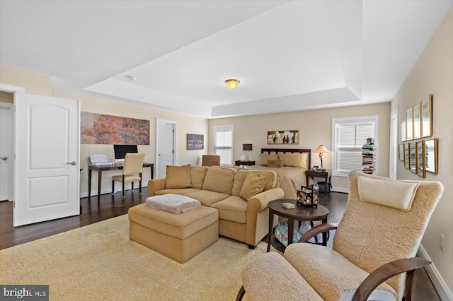 11135 Vanderbilt Cv, Spotsylvania, VA 22551 - living room with a raised ceiling, dark wood finished floors, an office area, and baseboards