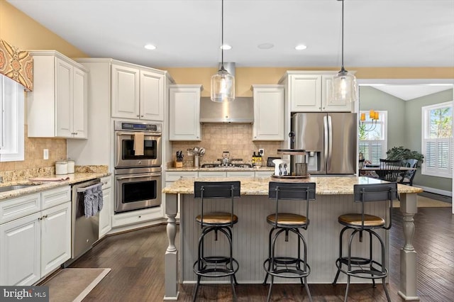 11135 Vanderbilt Cv, Spotsylvania, VA 22551 - kitchen featuring stainless steel appliances, wall chimney exhaust hood, white cabinets, dark wood-type flooring, and backsplash
