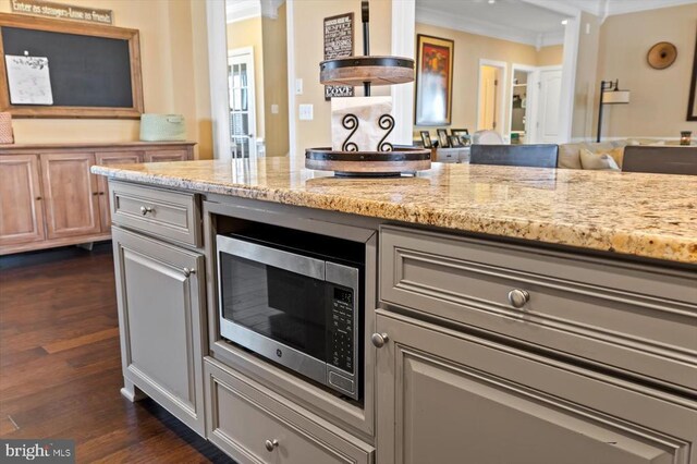 11135 Vanderbilt Cv, Spotsylvania, VA 22551 - kitchen featuring stainless steel microwave, ornamental molding, dark wood-style flooring, and light stone counters
