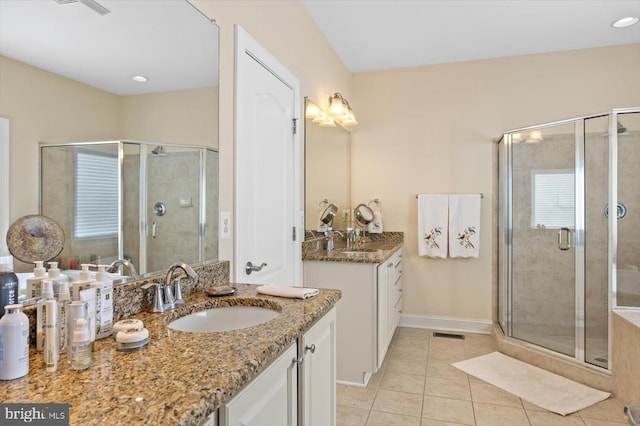 11135 Vanderbilt Cv, Spotsylvania, VA 22551 - bathroom featuring tile patterned floors, a stall shower, baseboards, two vanities, and recessed lighting