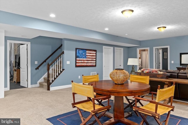 11135 Vanderbilt Cv, Spotsylvania, VA 22551 - dining area with stairs, carpet floors, baseboards, a textured ceiling, and recessed lighting