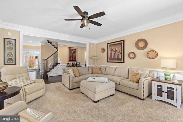 11135 Vanderbilt Cv, Spotsylvania, VA 22551 - living room featuring crown molding, stairs, ceiling fan, a wainscoted wall, and carpet flooring