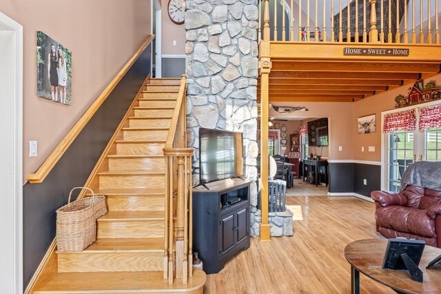 796 Battlecreek Rd, Stanley, VA 22851 - stairs with beam ceiling, wood finished floors, and baseboards