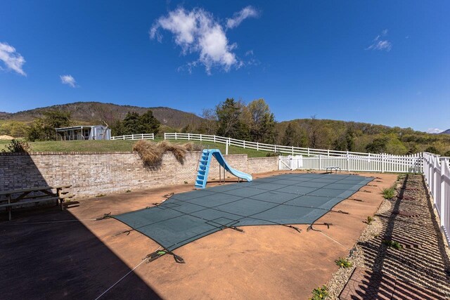 796 Battlecreek Rd, Stanley, VA 22851 - view of pool featuring fence, a water slide, a fenced in pool, and a mountain view