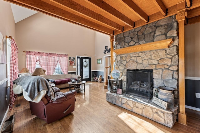 796 Battlecreek Rd, Stanley, VA 22851 - living room with wood finished floors, a fireplace, beamed ceiling, and high vaulted ceiling