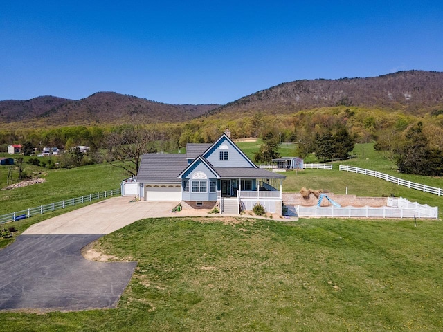 796 Battlecreek Rd, Stanley, VA 22851 - view of front of home with a front lawn, a mountain view, driveway, and fence