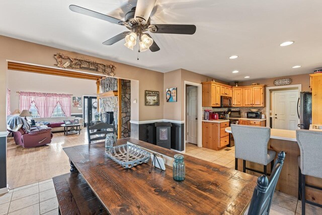 796 Battlecreek Rd, Stanley, VA 22851 - dining room with light tile patterned flooring, a fireplace, a ceiling fan, and recessed lighting