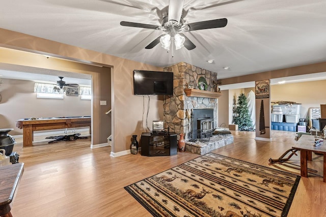 796 Battlecreek Rd, Stanley, VA 22851 - living area featuring pool table, baseboards, ceiling fan, wood finished floors, and a wood stove