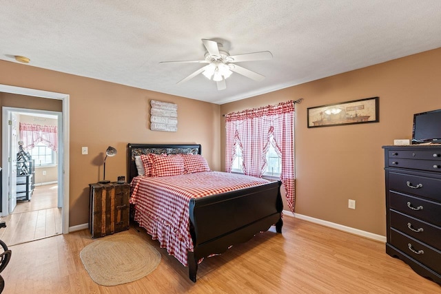796 Battlecreek Rd, Stanley, VA 22851 - bedroom with light wood-type flooring, baseboards, ceiling fan, and a textured ceiling