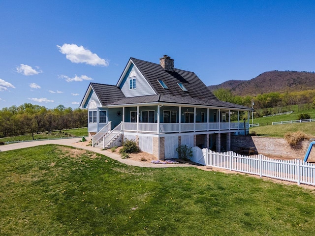796 Battlecreek Rd, Stanley, VA 22851 - rear view of house featuring a porch, a chimney, fence, and a lawn