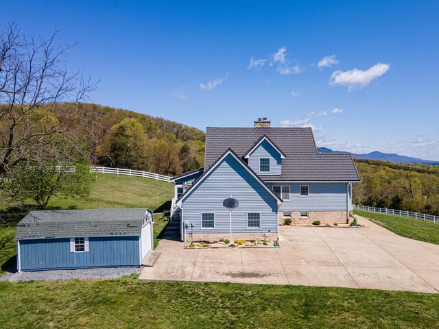 796 Battlecreek Rd, Stanley, VA 22851 - back of property featuring a yard, fence, an outbuilding, and a view of trees