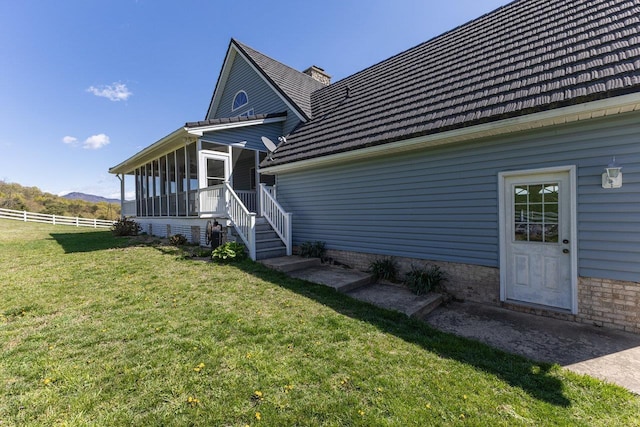 796 Battlecreek Rd, Stanley, VA 22851 - rear view of house with fence, a mountain view, a yard, a chimney, and a sunroom