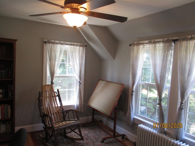 835 Rosser Ave, Waynesboro, VA 22980 - living area featuring radiator, a ceiling fan, wood finished floors, and vaulted ceiling