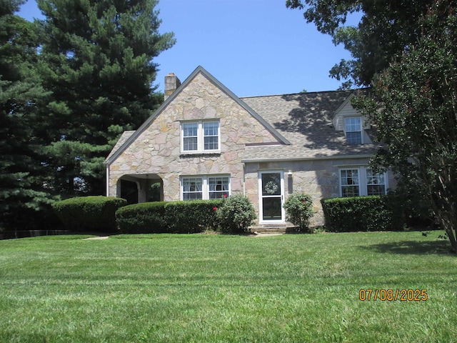 835 Rosser Ave, Waynesboro, VA 22980 - tudor house featuring stone siding, a chimney, and a front lawn