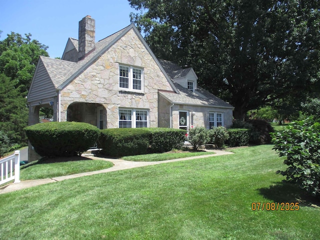 835 Rosser Ave, Waynesboro, VA 22980 - view of front of house with stone siding, a chimney, and a front lawn