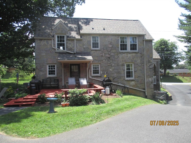 835 Rosser Ave, Waynesboro, VA 22980 - view of front of home featuring stone siding, a front lawn, a shingled roof, and a patio