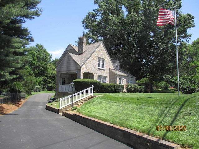 835 Rosser Ave, Waynesboro, VA 22980 - view of front of home featuring stone siding, a front yard, covered porch, and a chimney