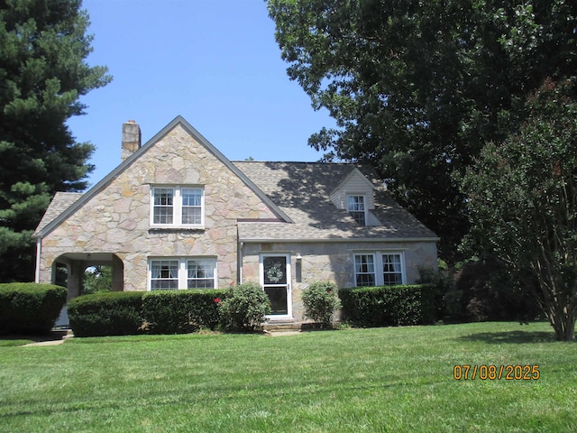 835 Rosser Ave, Waynesboro, VA 22980 - view of front of house with stone siding, a chimney, a front yard, and entry steps