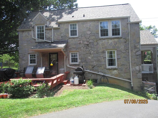 835 Rosser Ave, Waynesboro, VA 22980 - view of front of home featuring stone siding, a shingled roof, and a front yard