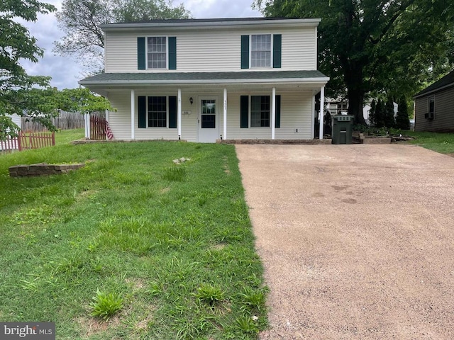 view of front of property featuring a porch and concrete driveway