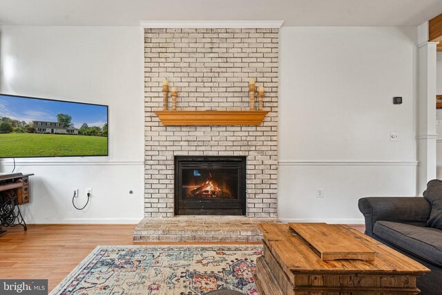  - living room with wood finished floors and a fireplace