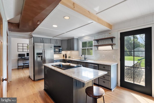  - kitchen featuring appliances with stainless steel finishes, light wood-style flooring, gray cabinetry, backsplash, and recessed lighting