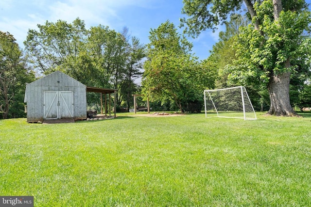  - view of yard featuring a storage unit and an area for sports
