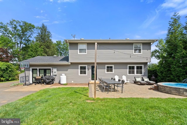  - back of property with a lawn and a patio area