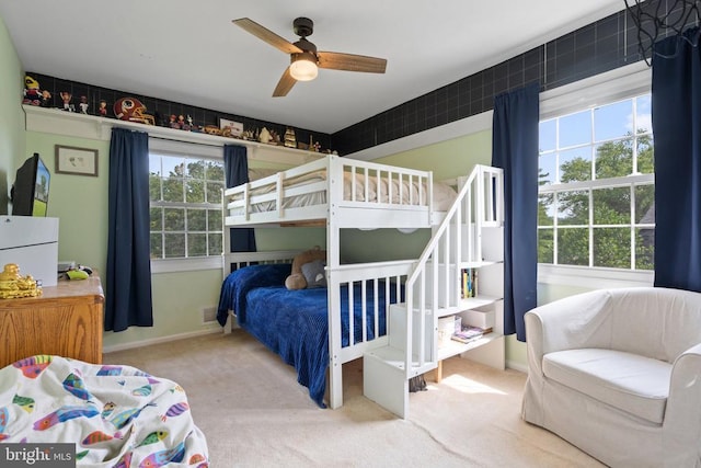 - bedroom with carpet flooring and a ceiling fan