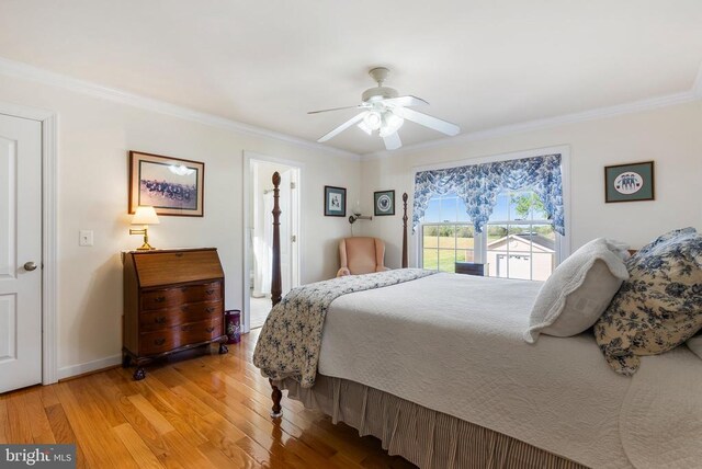 15103 Jenkins Hill Ln, Culpeper, VA 22701 - bedroom with crown molding, light wood-style floors, a ceiling fan, and baseboards