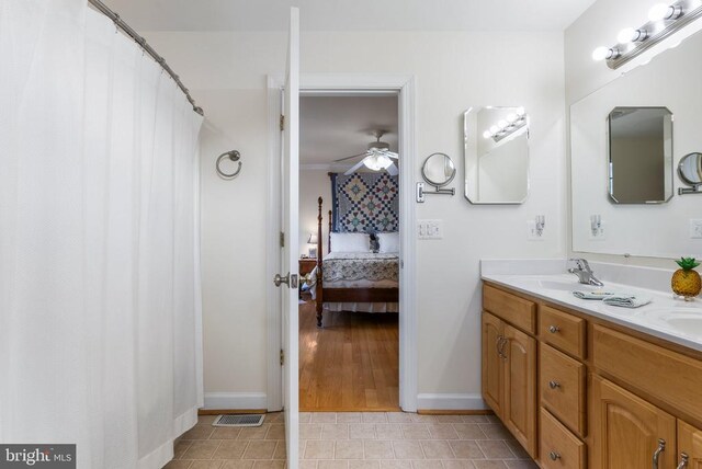 15103 Jenkins Hill Ln, Culpeper, VA 22701 - ensuite bathroom with a ceiling fan, baseboards, double vanity, and tile patterned flooring