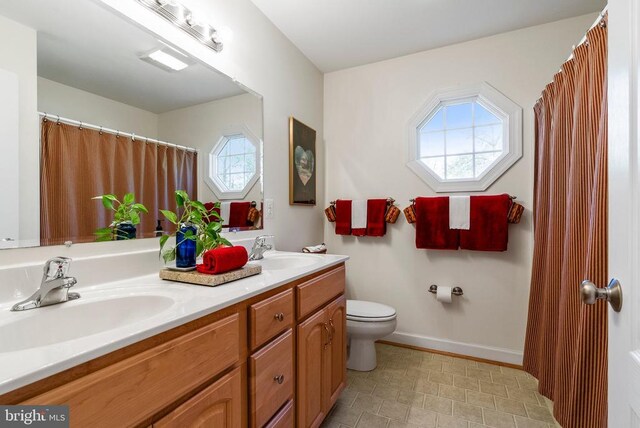 15103 Jenkins Hill Ln, Culpeper, VA 22701 - full bath featuring toilet, double vanity, and baseboards