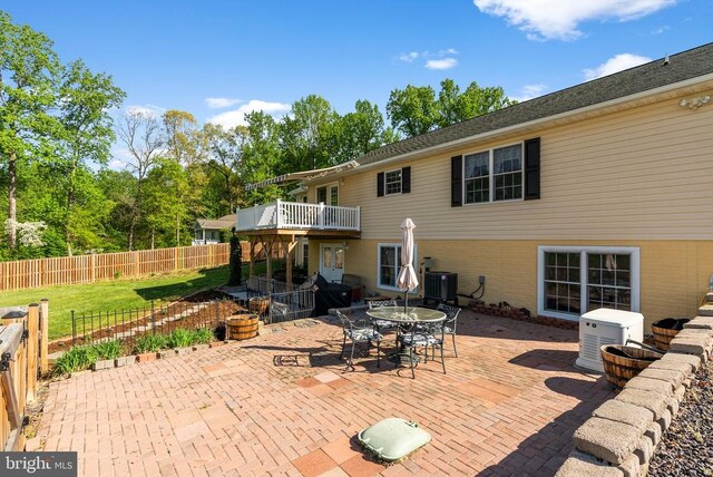 15103 Jenkins Hill Ln, Culpeper, VA 22701 - back of house with cooling unit, a patio area, fence, and outdoor dining space
