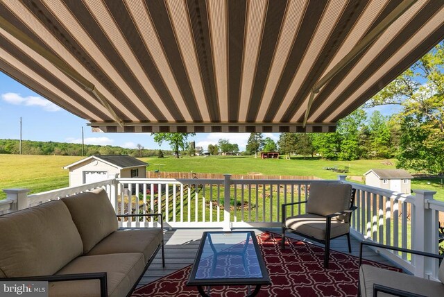 15103 Jenkins Hill Ln, Culpeper, VA 22701 - deck featuring an outbuilding, an outdoor hangout area, a storage unit, and a yard