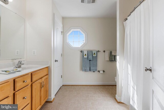 15103 Jenkins Hill Ln, Culpeper, VA 22701 - bathroom with vanity, tile patterned floors, toilet, and baseboards