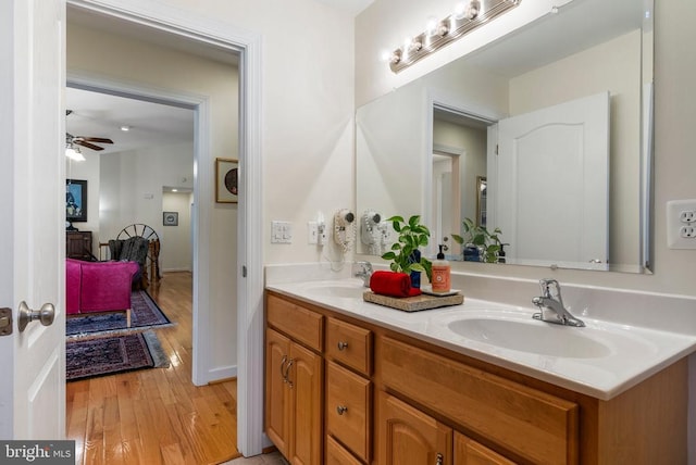 15103 Jenkins Hill Ln, Culpeper, VA 22701 - bathroom featuring wood finished floors, ceiling fan, and double vanity