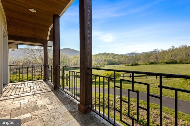  - balcony featuring a mountain view and a view of rural / pastoral area