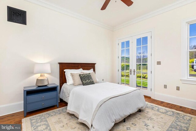  - bedroom with access to outside, crown molding, wood finished floors, baseboards, and ceiling fan