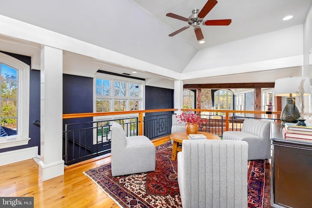  - living room with wood finished floors, a ceiling fan, recessed lighting, baseboards, and high vaulted ceiling