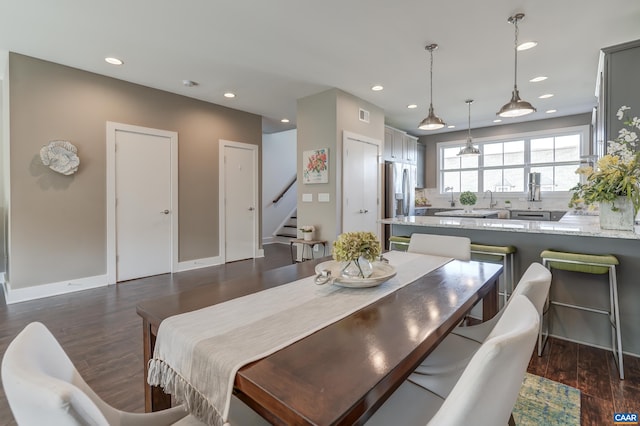 405 Fennel Rd, Crozet, VA 22932 - kitchen featuring a sink, a peninsula, wall chimney exhaust hood, gray cabinetry, and stainless steel fridge with ice dispenser