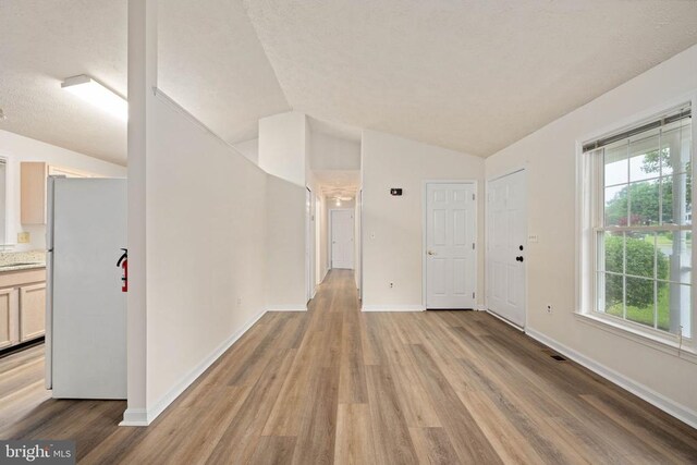 11810 Falcon Ridge Dr, Fredericksburg, VA 22407 - foyer with lofted ceiling, light wood finished floors, and baseboards